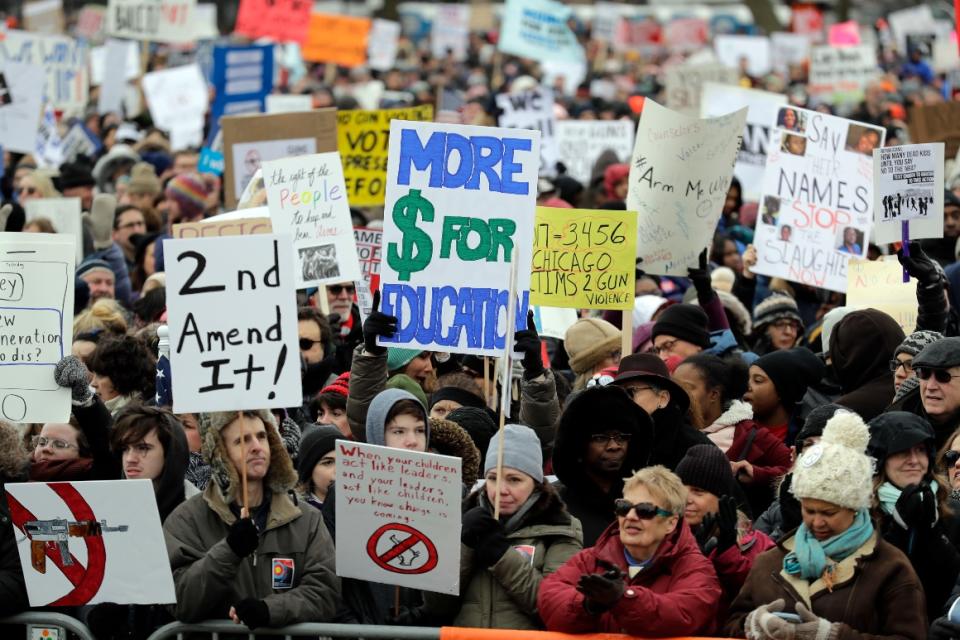 Demonstrators attend a March for Our Lives rally in support of gun control in Chicago.