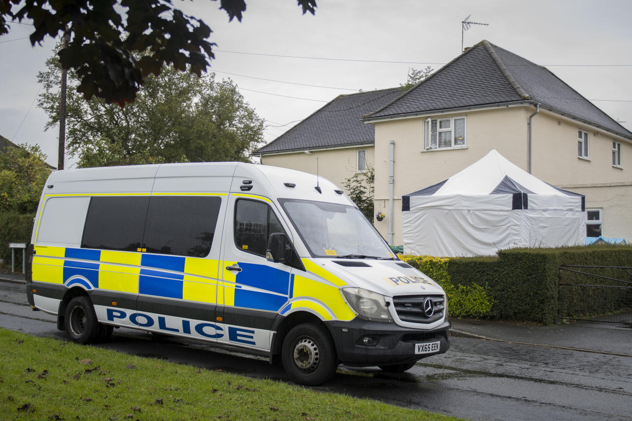 Police at a property in Gloucestershire. (SWNS)