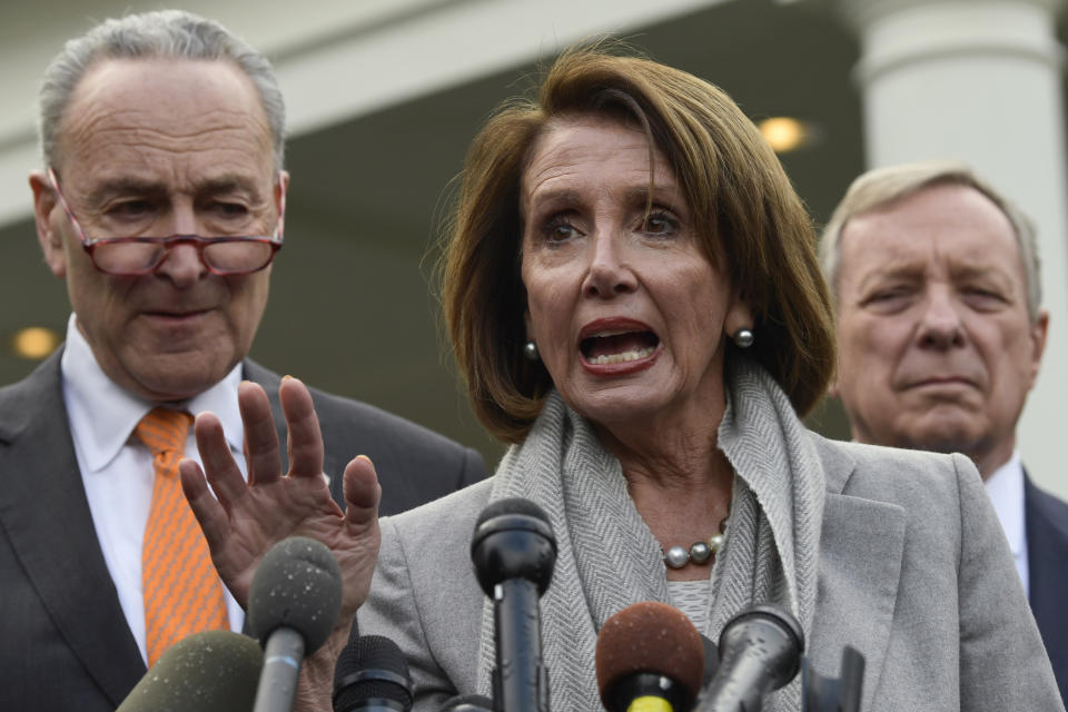 House Speaker Nancy Pelosi of Calif., center, speaks as she stands next to Senate Minority Leader Sen. Chuck Schumer of N.Y., left, and Sen. Dick Durbin, D-Ill., right, following their meeting with President Donald Trump at the White House in Washington, Wednesday, Jan. 9, 2019. (AP Photo/Susan Walsh)