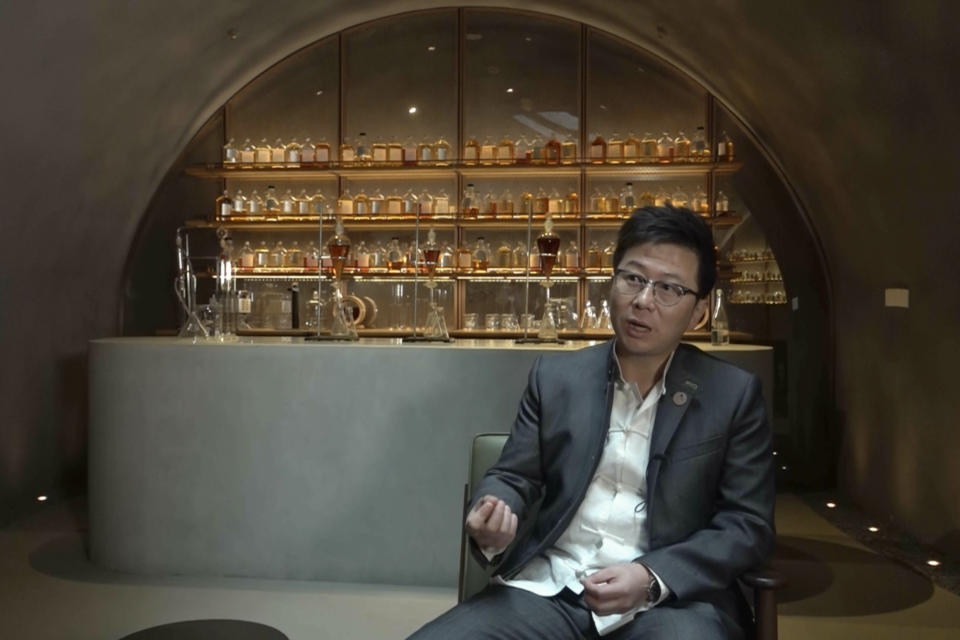 In this image from a video, Yang Tao, master distiller of The Chuan Malt Whisky Distillery speaks at the distillery in Emeishan in southwestern China's Sichuan province on Dec. 13, 2023. The more than $100 million distillery owned by Pernod Ricard and based at the UNESCO World Heritage site Mount Emei, launched a pure-malt whisky, The Chuan, aiming to tap a growing taste among young Chinese for whisky in place of the traditional "baijiu" used to toast festive occasions. (AP Photo/Caroline Chen)