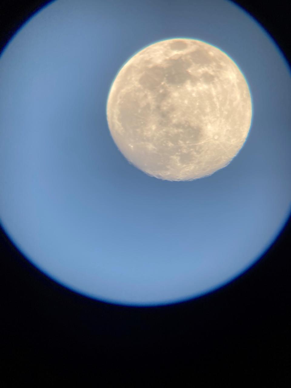 A view of the moon through a Celestron telescope.