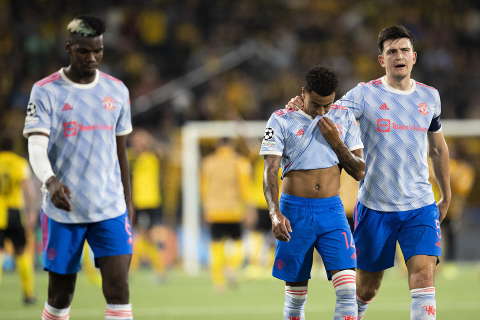 From left, Manchester United's Paul Pogba, Jesse Lingard and Harry Maguire leave the pitch after of the Champions League group F soccer match between BSC Young Boys and Manchester United, at the Wankdorf stadium in Bern, Switzerland, Tuesday, Sept. 14, 2021. (Peter Klaunzer/Keystone via AP)