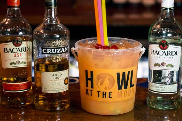 The Hurricane Bucket at Howl at the Moon is a generous portion of rums, juices, grenadine, and cherries and comes with many straws for many drinkers. 5/20/15