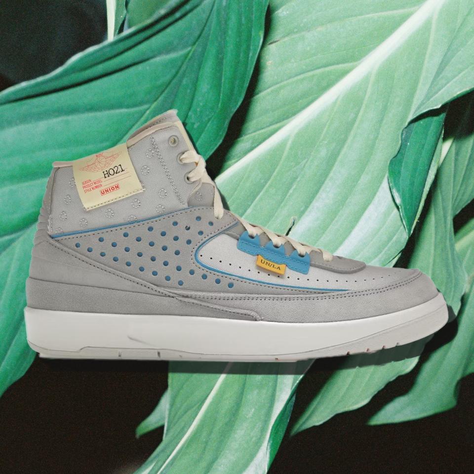 Jordan 2 Retro SP on a leafy green background