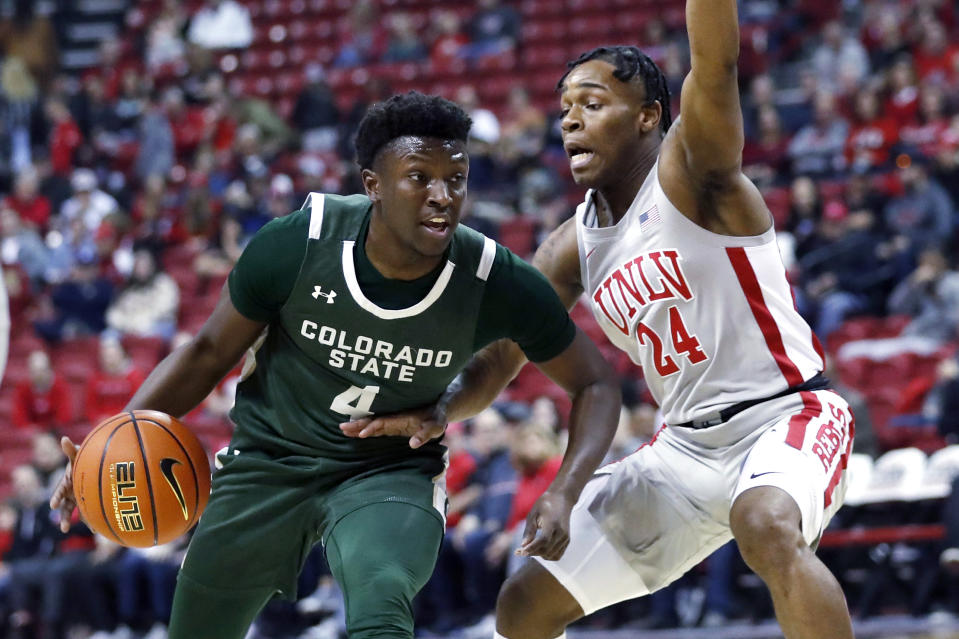 FILE - Colorado State guard Isaiah Stevens (4) drives against UNLV guard Jackie Johnson III (24) during the first half of an NCAA college basketball game in Las Vegas on Saturday, Jan. 14, 2023. Stevens is Colorado State’s all-time assists leader.(Steve Marcus/Las Vegas Sun via AP, File)