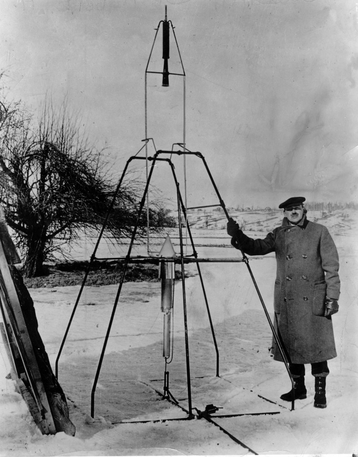Robert H. Goddard stands with the world's first liquid-propellant rocket on Pakachoag Hill in Auburn  March 16, 1926. When launched, the rocket soared 341 feet high and 184 feet downrange in 2.5 seconds.