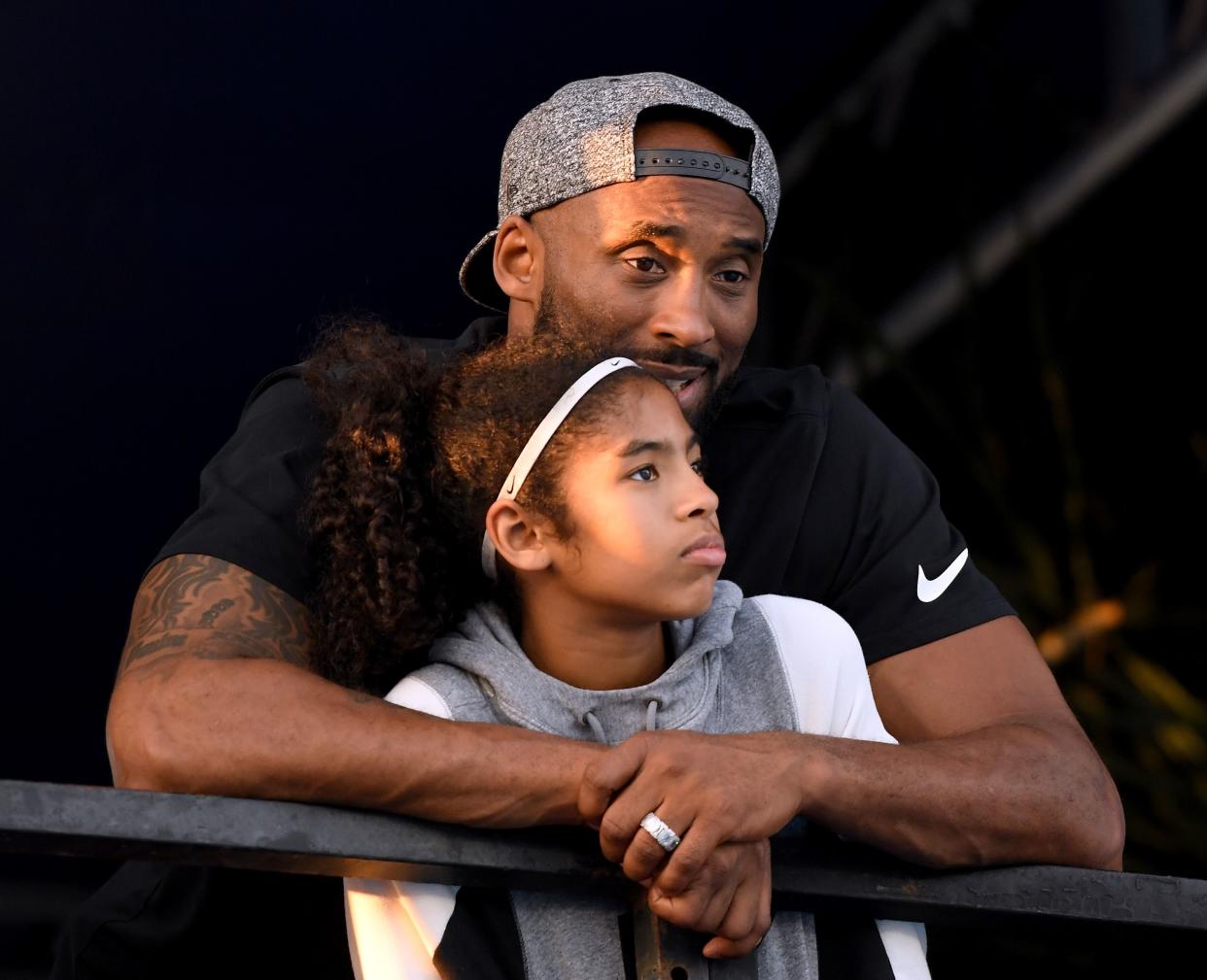 Kobe Bryant and daughter Gianna Bryant watch during day 2 of the Phillips 66 National Swimming Championships at the Woollett Aquatics Center on July 26, 2018 in Irvine, California.  (Photo: Harry How/Getty Images)