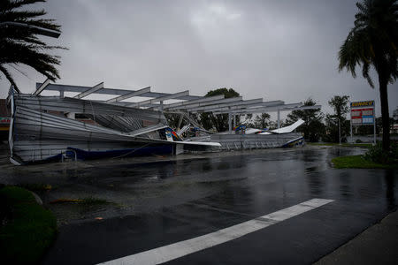 The crumbled canopy of a gas station damaged by Hurricane Irma is seen in Bonita Springs, Florida, U.S., September 10, 2017. REUTERS/Bryan Woolston