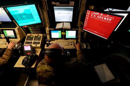 A U.S. airman controls the sensors on a U.S. Air Force drone from a command trailer at Kandahar Airfield, Afghanistan March 9, 2016. To match Exclusive AFGHANISTAN-DRONES/ REUTERS/Josh Smith/File Photo