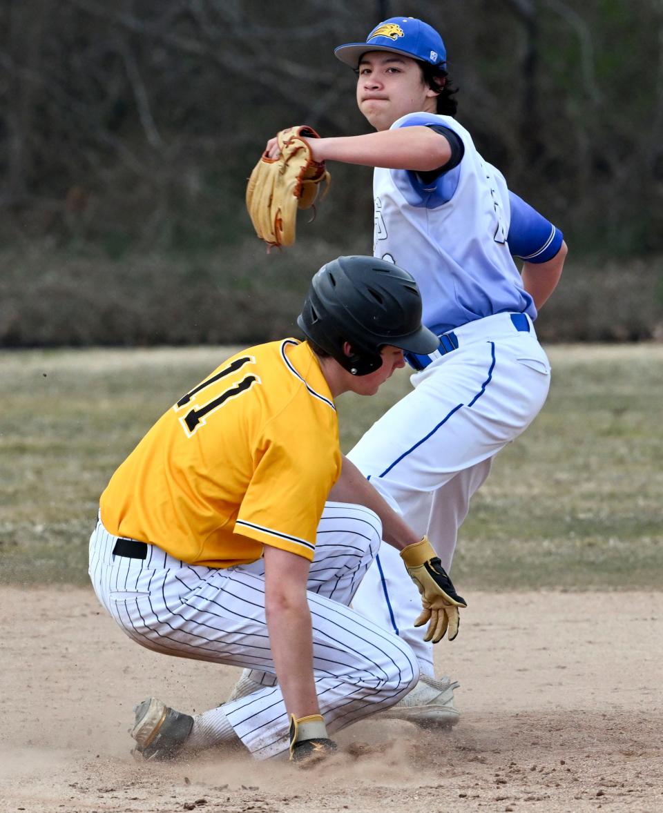 Ryan O'Keefe of Nauset breaks up a double play by St. John Paul II second baseman Ty Reed on Tuesday, April 4, 2023.