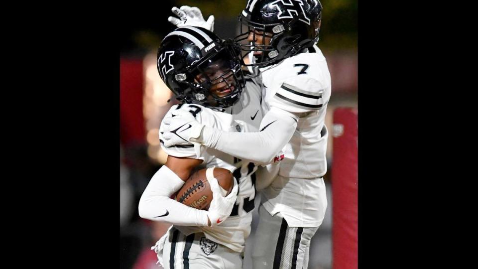 Houston County’s Darius Patterson (13) is congratulated by teammate JD Smith (7) after returning an interception for a touhdown during the Bears’ 45-38 win over Perry. Jason Vorhees/The Telegraph