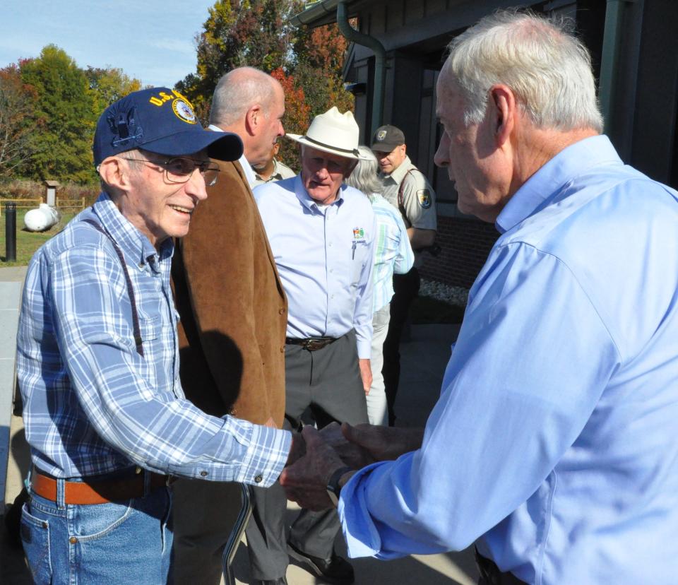 U.S. Sen. Tom Carper (right) talks with fellow Navy veteran Jim Webb after the ribbon-cutting ceremony for the new visitors center at Bombay Hook National Wildlife Refuge Friday, Oct. 27, 2023. Webb served as a volunteer with the Friends of Bombay Hook.