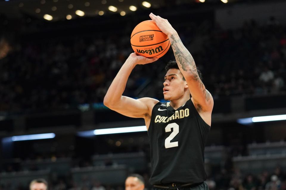 Colorado Buffaloes guard KJ Simpson (2) shoots against the Marquette Golden Eagles during the first half at Gainbridge FieldHouse on March 24 in Indianapolis.