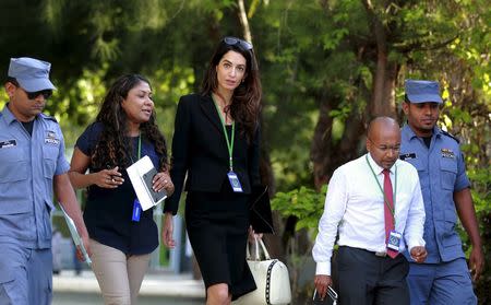 Amal Clooney (C), lawyer of former Maldives president Mohamed Nasheed, leaves Maafushi prison after meeting Nasheed in the Maldives September 8, 2015. REUTERS/Waheed Mohamed