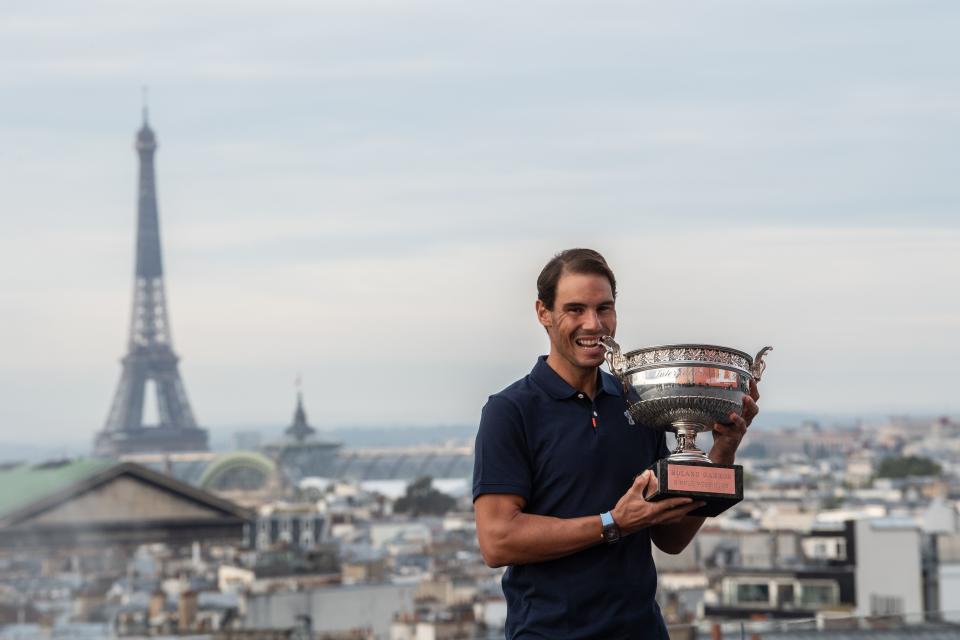 Spain's Rafael Nadal holds the Mousquetaires Cup (The Musketeers) during a photocall a day after winning the men's singles of The Roland Garros 2020.