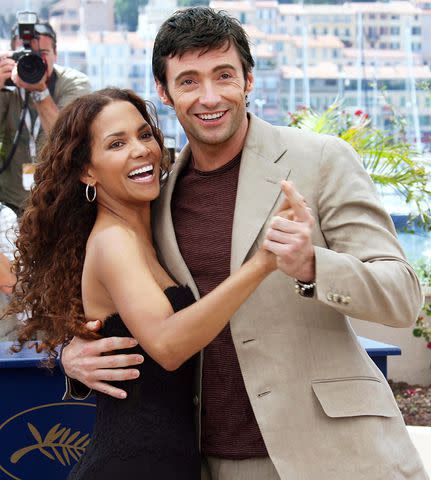 <p>Valery Hache/AFP/Getty</p> Halle Berry and Hugh Jackman in 2006