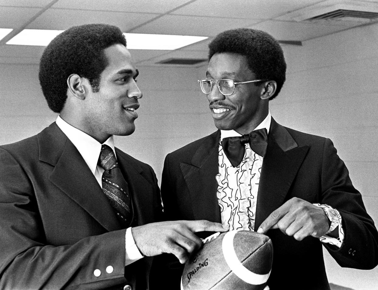 Record-smashing Buffalo Bills running back O.J. Simpson, left, talks football with teammate Robert James on April 22, 1974. James, an All-Pro cornerback, was honored in his hometown of Murfreesboro, Tenn., and Simpson came to add to his tribute.