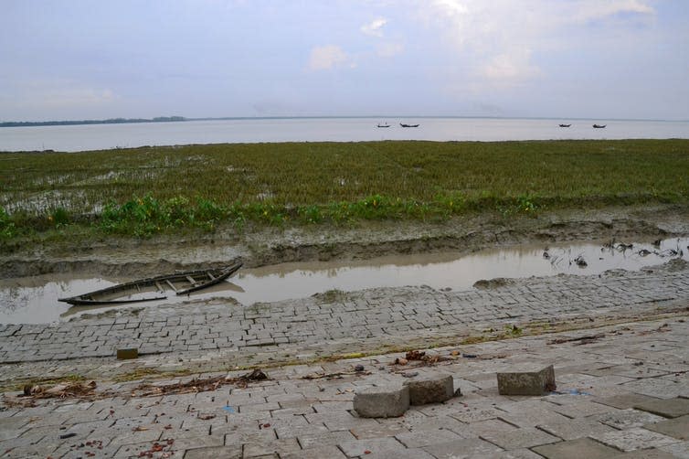 <span class="caption">Cyclone strikes, followed by flooding and standing water, tend to speed up land erosion.</span> <span class="attribution"><span class="source">Sonja Ayeb-Karlsson</span></span>