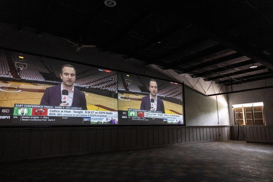 Two 85-inch televisions line the wall at the new Concord Event Center.