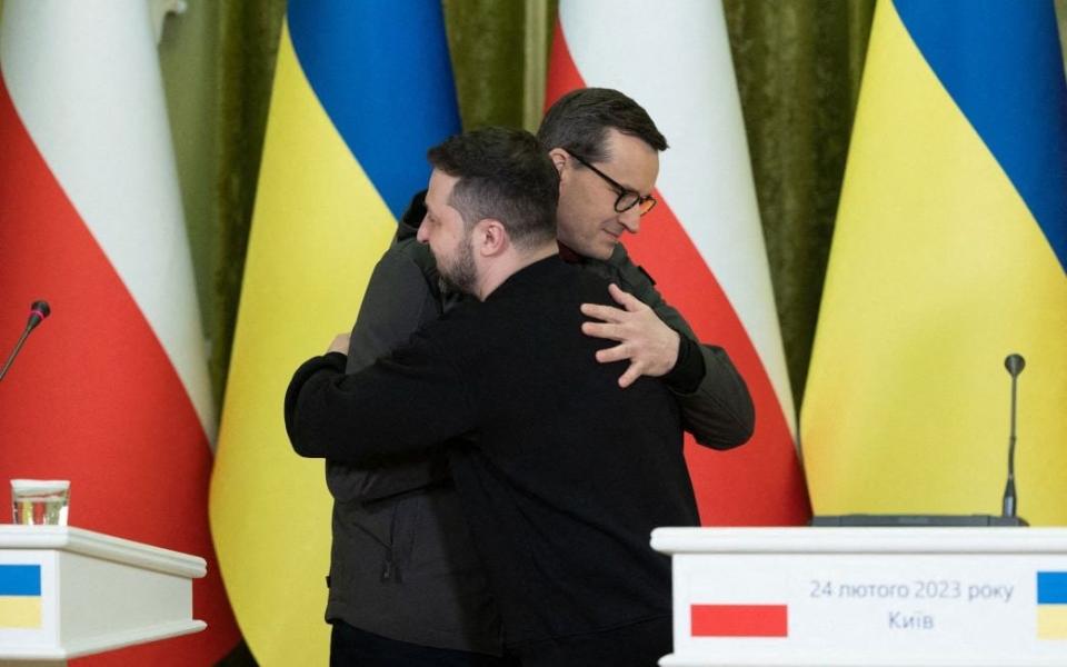 Ukrainian President Volodymyr Zelensky (L) and Polish Prime Minister Mateusz Morawiecki greeting each other after a joint press conference - STR/UKRAINIAN PRESIDENTIAL PRESS SER/AFP via Getty Images