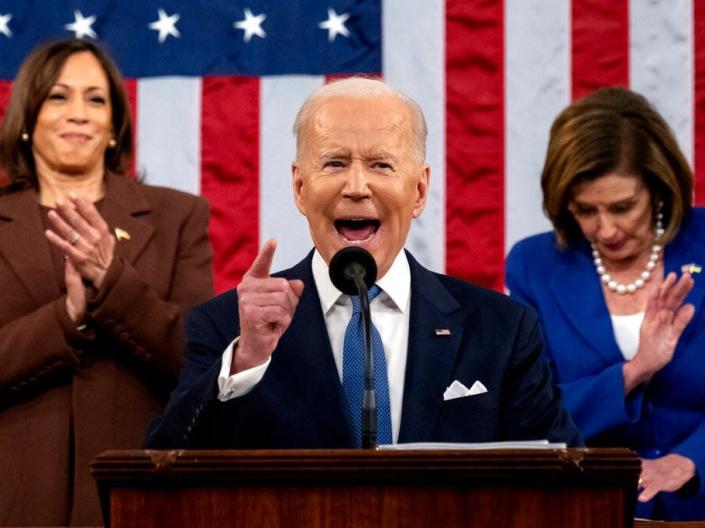 President Joe Biden delivers his first State of the Union address to a joint session of Congress at the Capitol, as Vice President Kamala Harris and House Speaker Nancy Pelosi of Calif., watch, Tuesday, March 1, 2022, in Washington.