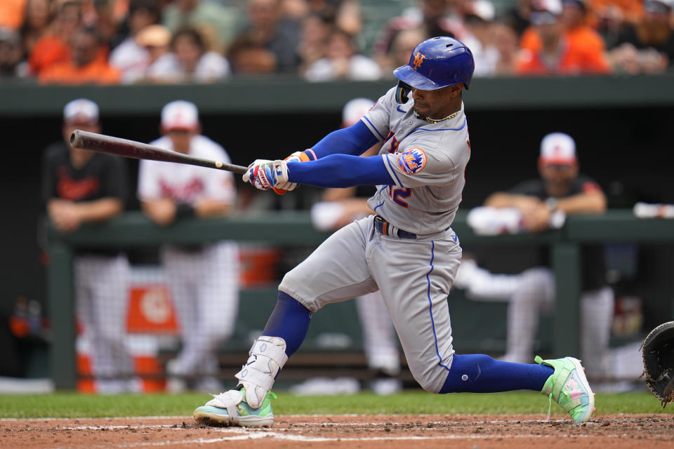 New York Mets' Francisco Lindor follows through on a swing while hitting a single against the Baltimore Orioles during the fifth inning of a baseball game, Sunday, Aug. 6, 2023, in Baltimore. (AP Photo/Julio Cortez)