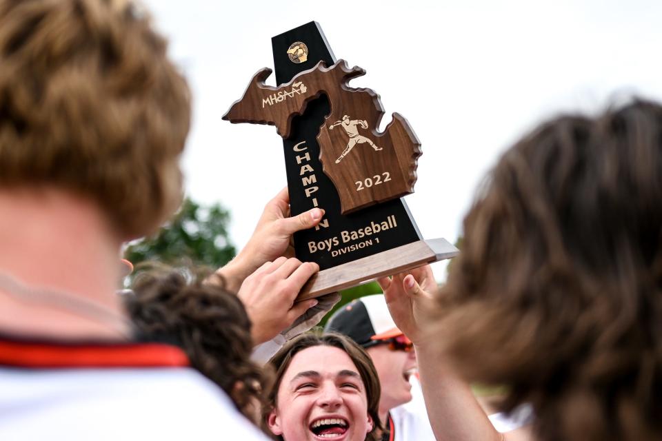 Brighton celebrates after beating Howell, 5-4, to win the Division 1 baseball district title on Saturday, June 4, 2022 in East Lansing.