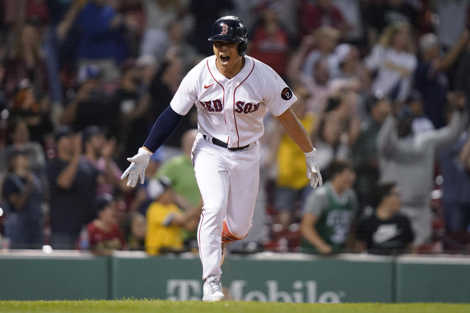 Boston Red Sox's Rob Refsnyder celebrates after driving in the winning run with a single during the ninth inning of the team's baseball game against the Texas Rangers, Thursday, Sept. 1, 2022, in Boston. The Red Sox won 9-8. (AP Photo/Steven Senne)