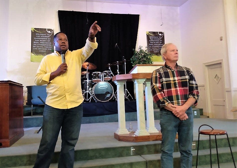 Ward 6 Councilman Aaron Banks, left, is joined by federally appointed third party water system administrator Ted Henifin Monday night at Glory Empowerment Center in south Jackson.