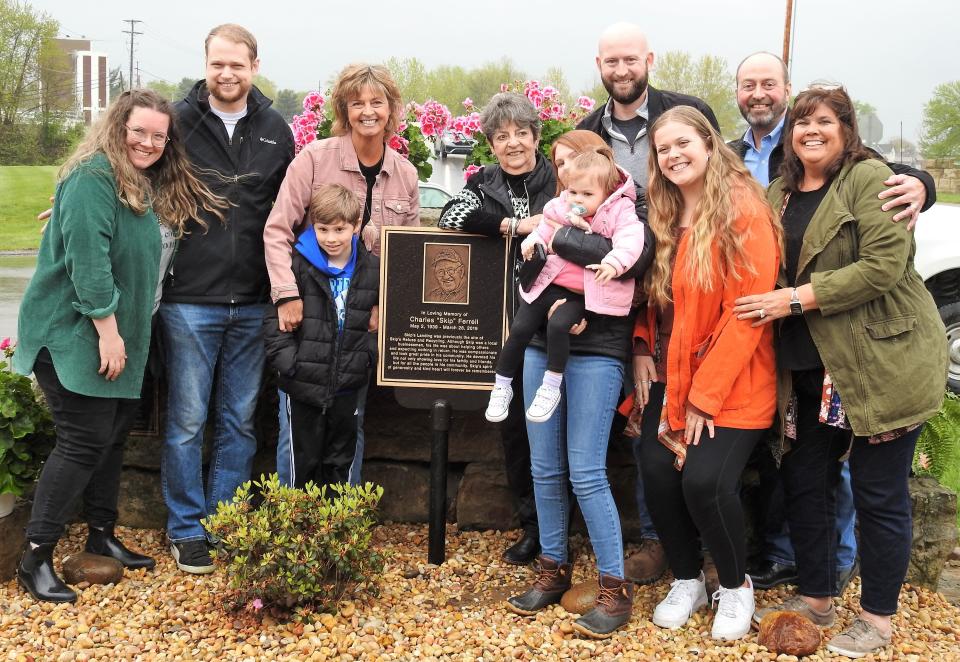 The Family of Charles "Skip" Ferrell with a plaque dedicating Skip's Landing to his memory. The land was once Skip's Refuse and is now a public park with river access, picnic tables, bike rack and plans for more.