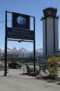 This May 24, 2021, photo shows the sign for the Open Door Baptist Church along a highway leading into Anchorage, Alaska. The church has replaced a strip club that used to beckon people off the highway. (AP Photo/Mark Thiessen)