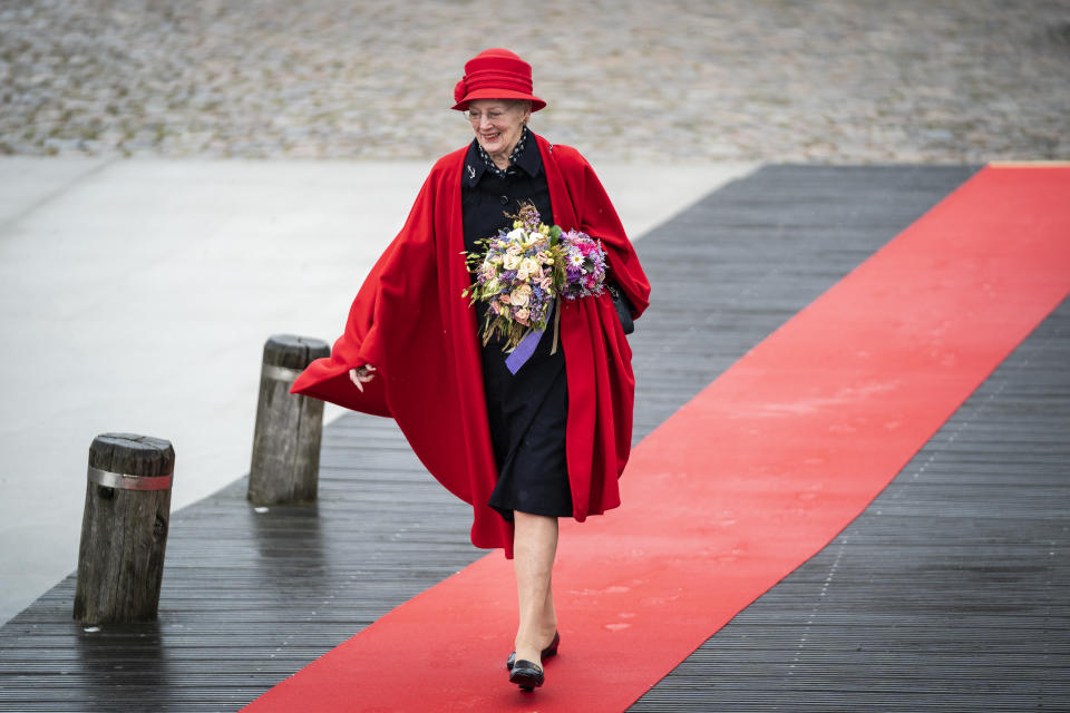 FILE - Queen Margrethe of Denmark boards the royal ship Dannebrog in the harbour of Copenhagen, May 4, 2021. Denmark’s popular monarch Queen Margrethe is marking 50 years on the throne with low-key events on Friday Jan. 14, 2022. The public celebrations of Friday's anniversary have been delayed until September due to the pandemic. (Emil Helms/Ritzau Scanpix via AP)