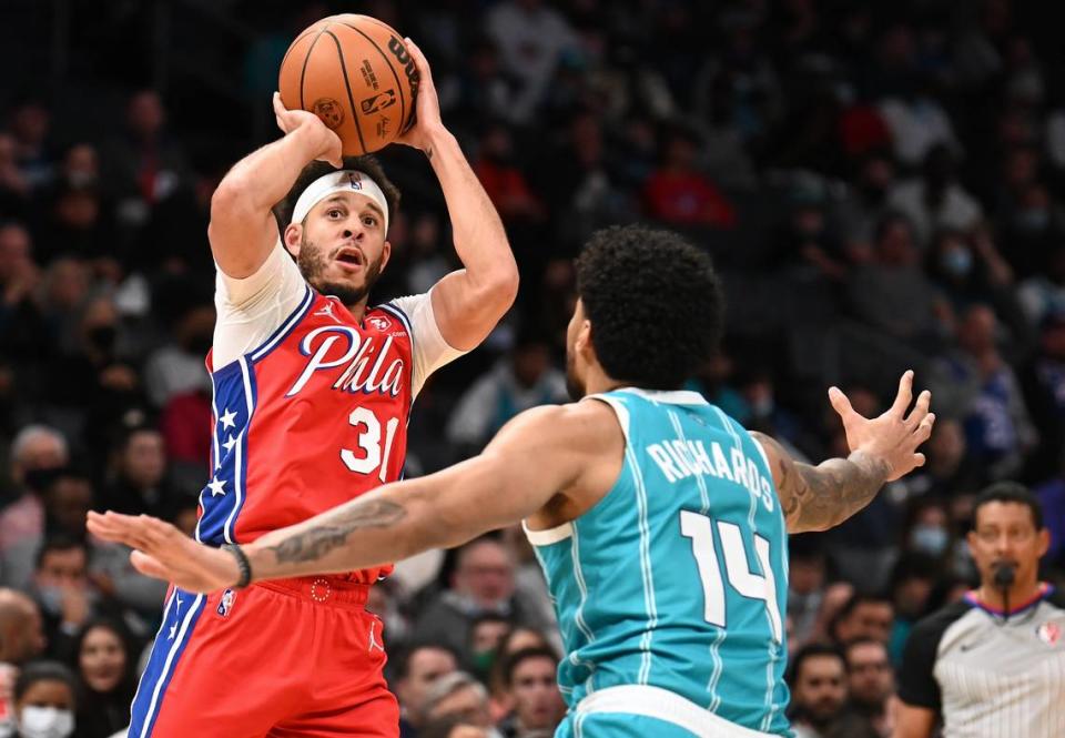 Seth Curry, playing for Philadelphia in 2021, launches a shot against Charlotte. Curry was traded to the Hornets Thursday.