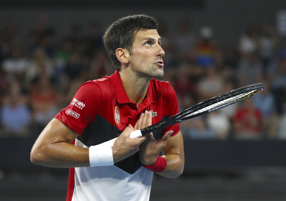 Novak Djokovic of Serbia talks to the umpire during his match against Kevin Anderson of South Africa at the ATP Cup tennis tournament in Brisbane, Australia, Saturday, Jan. 4, 2020. (AP Photo/Tertius Pickard)