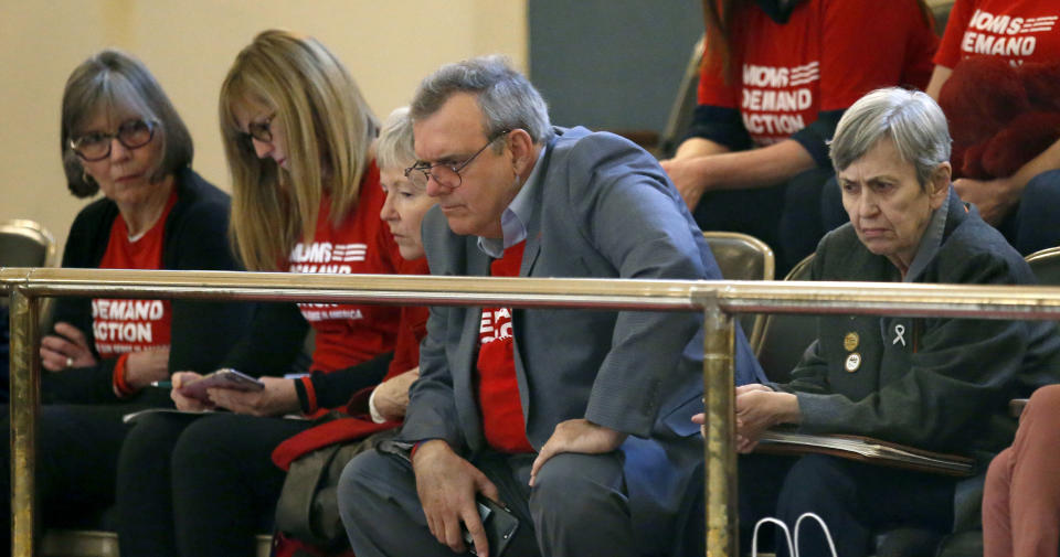 Neil Hester, center, and other members of the Oklahoma chapter of Moms Demand Action for Gun Sense in America watch debate on a permitless carry bill on the Senate floor Tuesday, Feb. 26, 2019, at the state Capitol in Oklahoma City. (AP Photo/Sue Ogrocki)