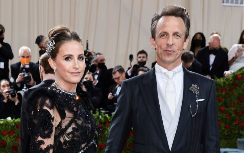 A closeup of Alexi Ashe and Seth Meyers smiling