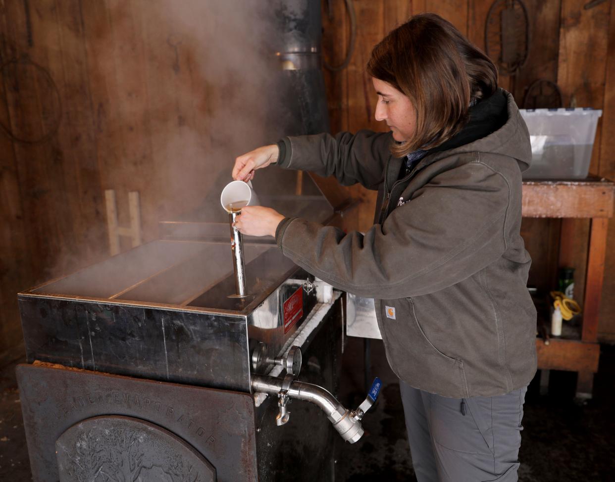A curator at Trailside Nature Museum pours syrup into a hydrometer at the Ward Pound Ridge Reservation's Sugar House in 2019. Learn how maple syrup is made at one of several Westchester County parks this 2024 sugaring season.
