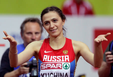 FILE PHOTO: Mariya Kuchina of Russia reacts after winning the women's high jump event during the IAAF European Indoor Championships in Prague March 7, 2015. REUTERS/David W Cerny/File Photo