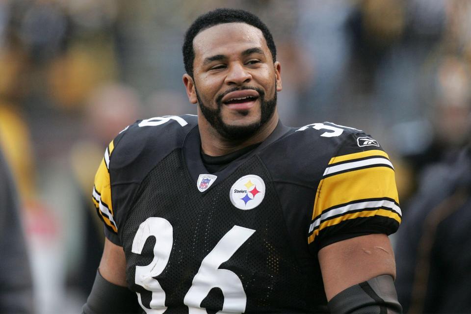 Jerome Bettis #36 of the Pittsburgh Steelers smiles and acknowledges the fans after receiving an ovation while being honored on the video scoreboard in the final home game of his career during their victory in NFL game action against the Detroit Lions at Heinz Field on January 1, 2006 in Pittsburgh, Pennsylvania.