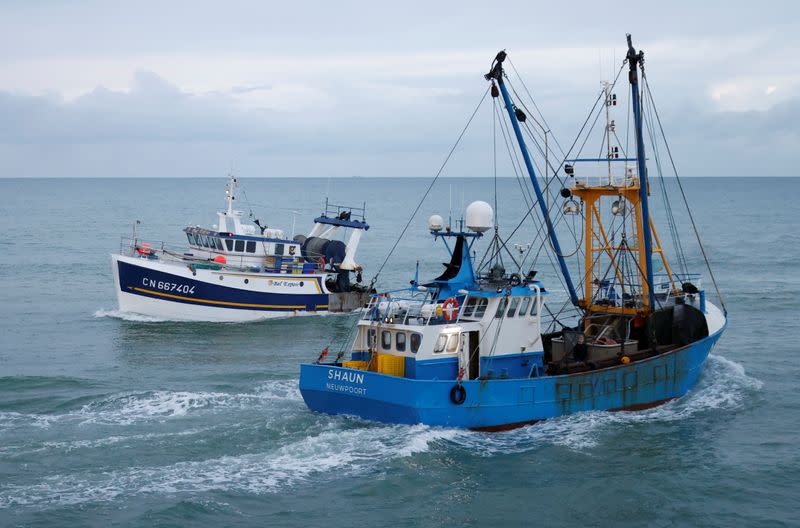 Trawler sail off the fishing port in Port-en-Bessin-Huppain