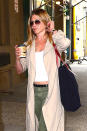 <p>Jennifer looked pretty serious about her coffee here. Hey, we totally get it! (Photo: AKM-GSI) </p>