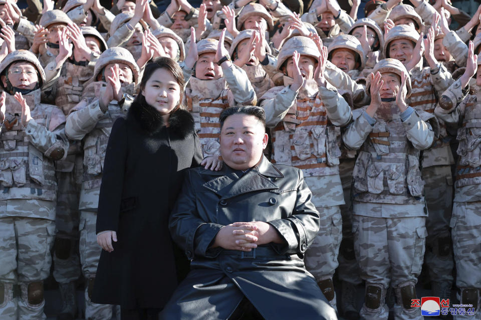 This undated photo provided on Nov. 27, 2022, by the North Korean government shows North Korean leader Kim Jong Un, center right, and his daughter, center left, with soldiers, pose for a photo, following the launch of what it says a Hwasong-17 intercontinental ballistic missile, at an unidentified location in North Korea. Independent journalists were not given access to cover the event depicted in this image distributed by the North Korean government. The content of this image is as provided and cannot be independently verified. Korean language watermark on image as provided by source reads: "KCNA" which is the abbreviation for Korean Central News Agency. (Korean Central News Agency/Korea News Service via AP)