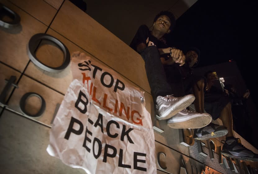 Justin Mullen listens to a speaker outside LAPD headquarters during a Black Lives Matter protest downtown.