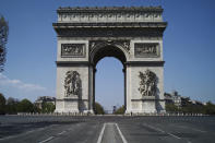 View of the deserted Arc of Triomphe during nationwide confinement measures to counter the Covid-19, in Paris, Thursday, April 9, 2020. The new coronavirus causes mild or moderate symptoms for most people, but for some, especially older adults and people with existing health problems, it can cause more severe illness or death. (AP Photo/Thibault Camus)