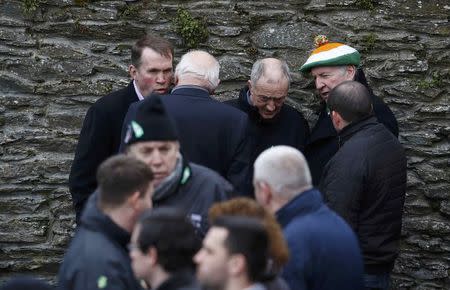 Mourners gather during Martin McGuinness's funeral, at St Columba's Church in Londonderry, Northern Ireland, March 23, 2017. REUTERS/Phil Noble