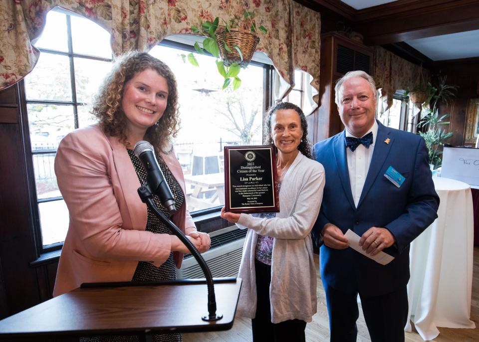 The Rotary Club named Lisa Parker, center, as Hampton's Citizen of the Year during a special event Tuesday, May 10, 2022, at the Old Salt Restaurant. Also pictured is Rotary Club chair and Vice President Martha Clyde and President Geoff Merrill.
