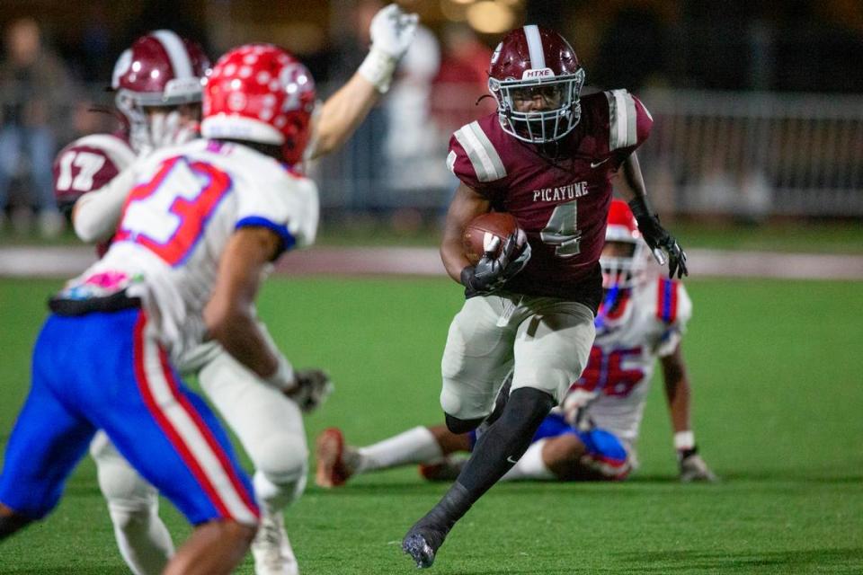 Picayune’s Darrell Smith runs the ball during a playoff game at Lee-Triplett Stadium in Picayune on Friday, Nov. 17, 2023.