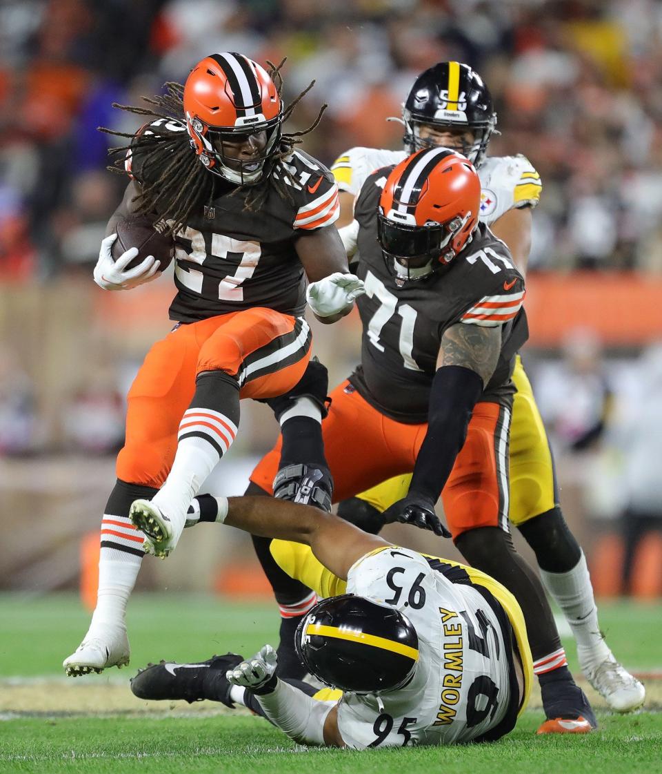 Browns running back Kareem Hunt leaps over Steelers defensive tackle Chris Wormley during the first half Thursday, Sept. 22, 2022, in Cleveland.