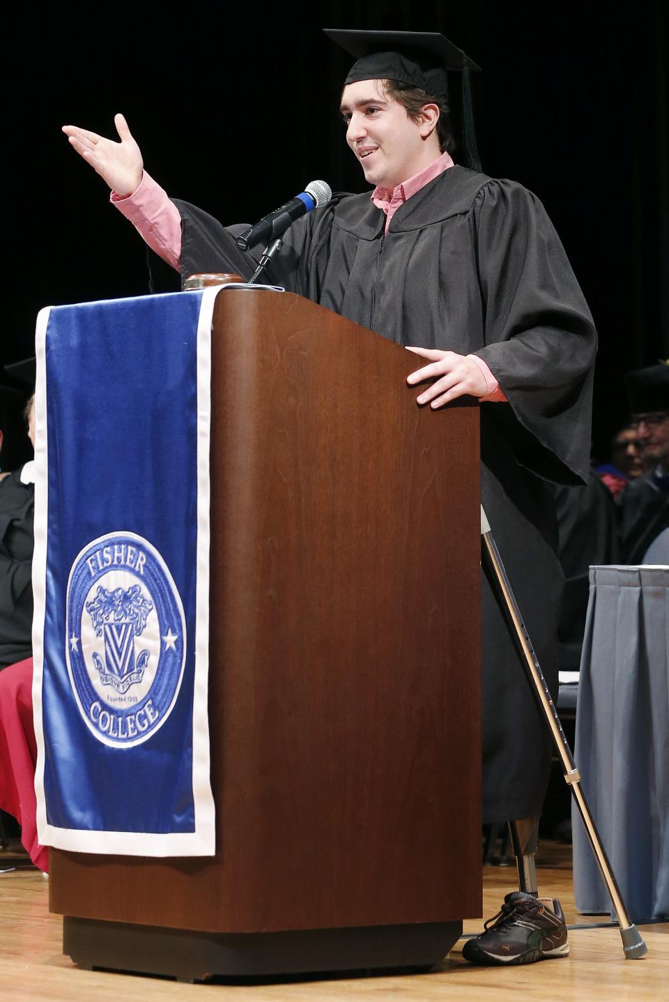 Boston Marathon bombing survivor Jeff Bauman gives the commencement address during graduation ceremonies for Fisher College in Boston, Saturday, May 10, 2014. Bauman lost his legs in the attack. He told graduates at Fisher College in Boston on Saturday to keep moving forward and seize the opportunities that lie ahead. (AP Photo/Michael Dwyer)