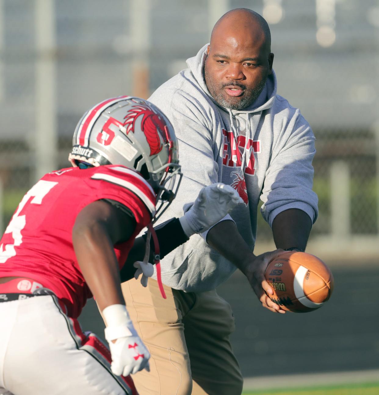East head coach Marques Hayes has been a fixture on the Dragons sideline and is helping his athletes earn college scholarships.